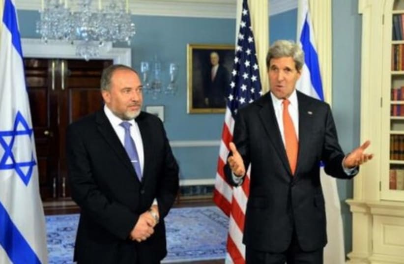 Foreign Minister Avigdor Liberman meets with US Secretary of State John Kerry in Washington, April 9, 2014. (photo credit: US STATE DEPARTMENT)