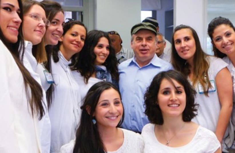Jewish Agency chairman Natan Sharansky meets with French-language service representatives at the agency’s Global Service Center. (photo credit: JAFI)