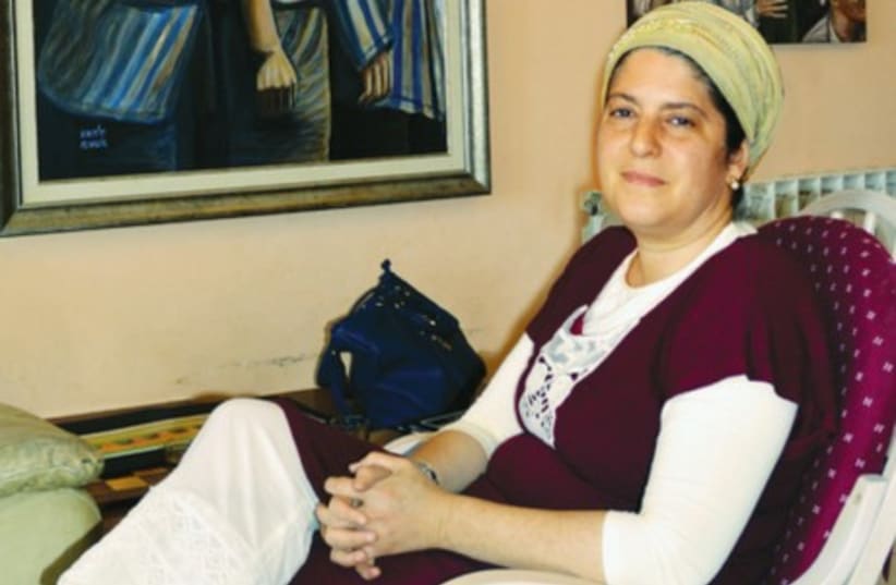 GUELA TWERSKY sits in her home (photo credit: COURTESY DAPEI KATOM)