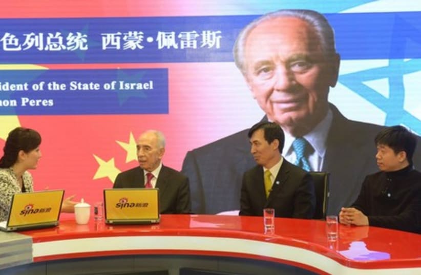 President Shimon Peres is a guest at Weibo, China's social media giant. (photo credit: GPO/AMOS BEN GERSHOM)