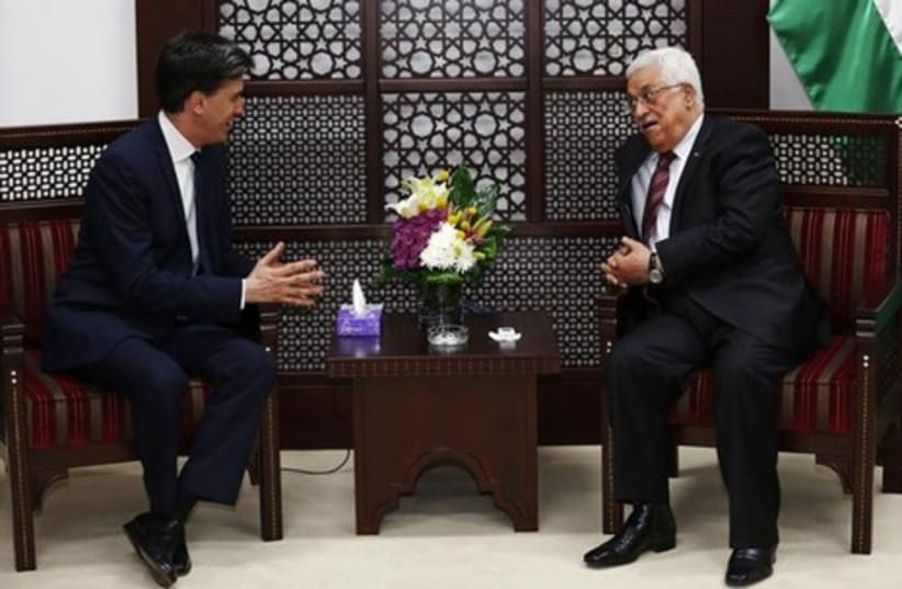PA President Mahmoud Abbas (R) meets with Britain's Labour Party leader Ed Miliband in Ramallah April 12, 2014.  (photo credit: REUTERS)