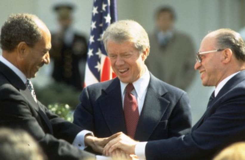 Sadat, Carter, Begin, in 1979 after signing of peace treaty. (photo credit: TAL SHABTAI/GPO)