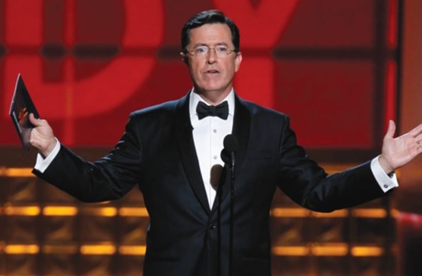 Comedy Central host Stephen Colbert who plays a conservative pundit will drop the character when he takes the reins from late-night legend David Letterman. (photo credit: REUTERS)