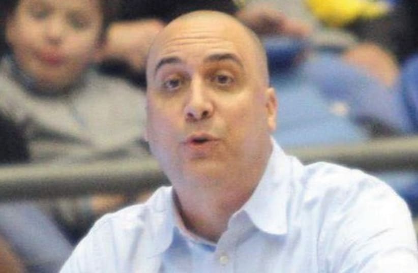 Maccabi Ashdod coach Eric Alfasi breathed a huge sigh of relief last night after his team avoided relegation to the National League, at least for a few more days (photo credit: ADI AVISHAI)