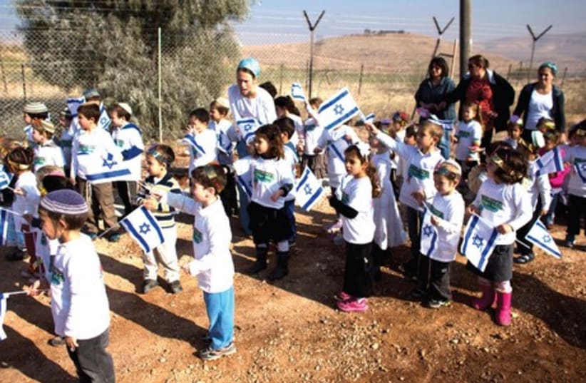 Children at dedication ceremony of a new neighborhood in the settlement of Gitit in Jordan Valley (photo credit: REUTERS/Ronen Zvulun)