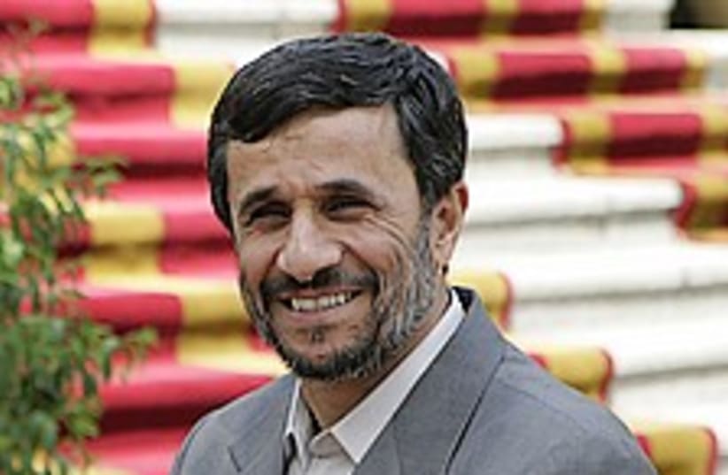Ahmadinejad happy 224.88 (photo credit: AP)
