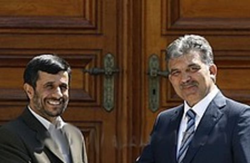 Ahmadinejad gul 224.88 (photo credit: AP)