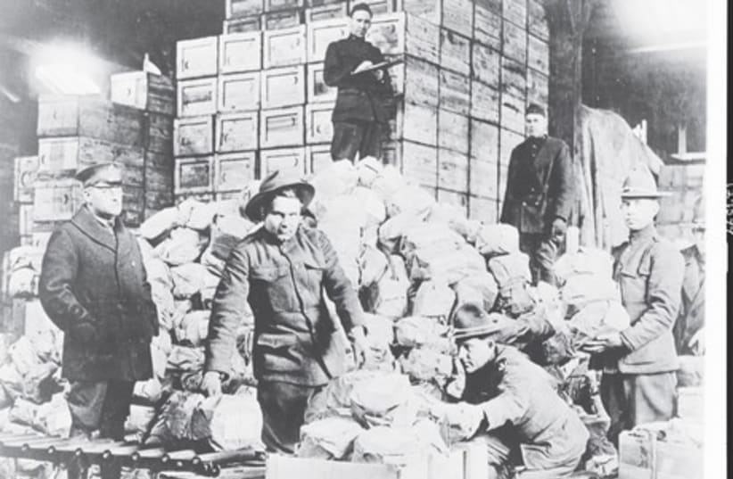 Packing a shipment of matzot on April 9, 1919 for the 77th division for men of Jewish faith in the American Expeditionary Force for Passover, at Warehouse No. 40, Q.M.C. Depot, St. Denis (France) (photo credit: LIBRARY OF CONGRESS)