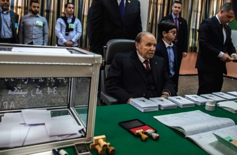  President Abdelaziz Bouteflika votes in Algiers on Thursday. (photo credit: ZOHRA BENSEMRA/REUTERS)