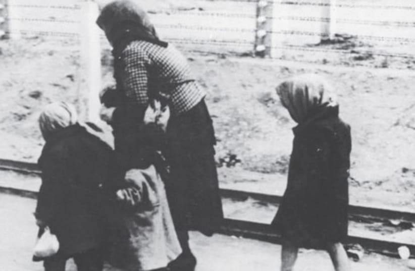 CHILDREN AND an old woman on the way to the death barracks of Auschwitz-Birkenau in Poland.  (photo credit: GERMAN FEDERAL ARCHIVES)