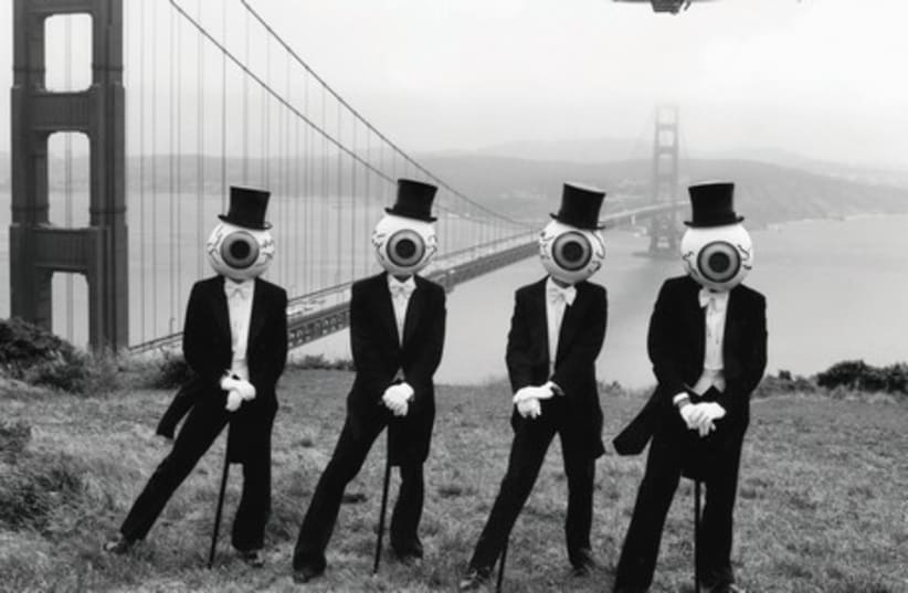 EYE SPY: The Residents are known for dressing up in tuxes, tails, top hats, canes and...giant eyeball heads. They have released over 60 albums, the most recent in 2013. (photo credit: Courtesy)