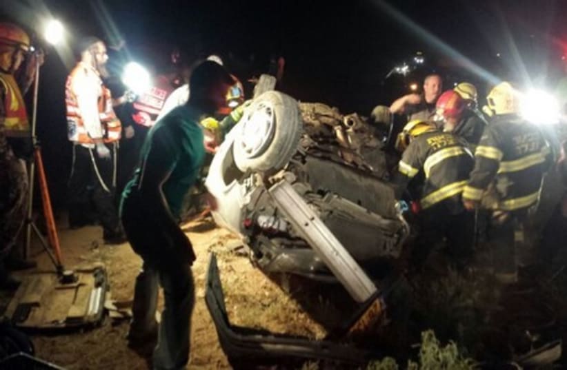 The overturned car involved in the head-on collision on Highway 90. (photo credit: NEWS 24)