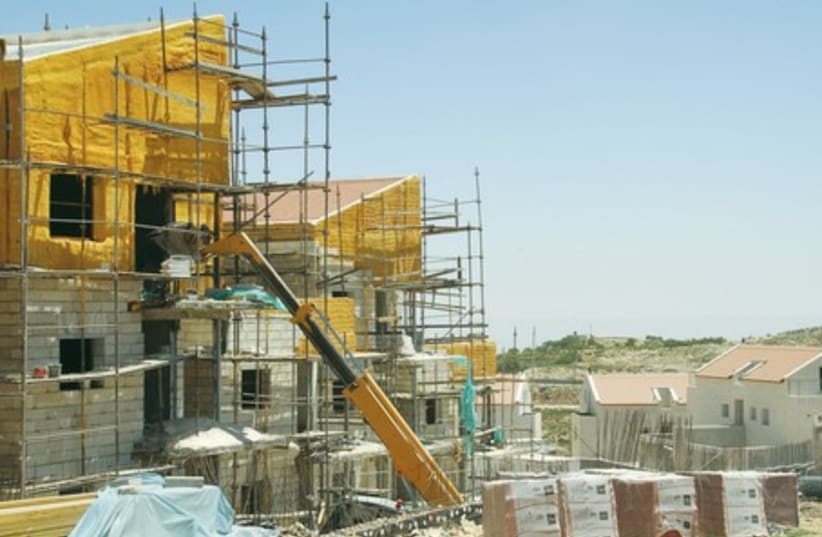 Construction in West Bank settlement of Efrat, April 29, 2014. (photo credit: TOVAH LAZAROFF)