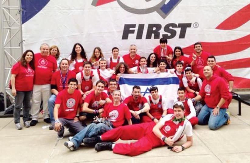 A group of pupils from Eilat pose after winning the Rookie All-Star prize at the First Robotics competition in St. Louis last week. (photo credit: Courtesy)