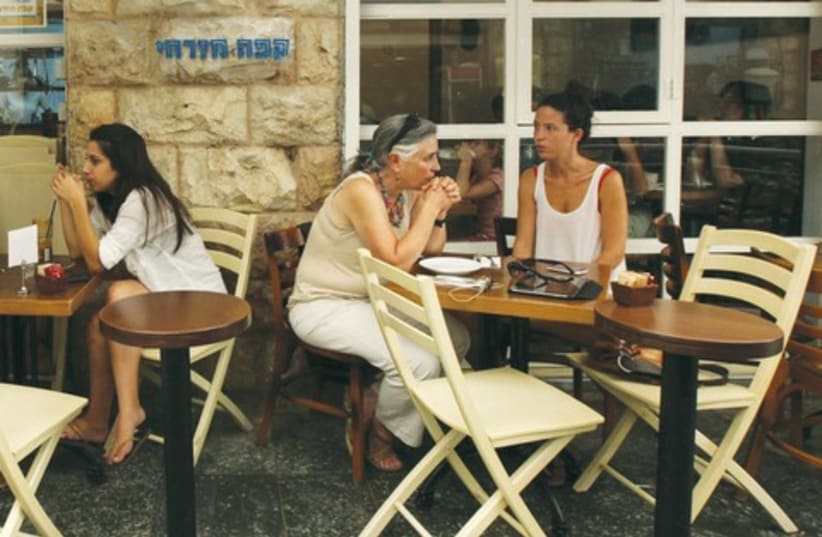 Secular patrons at a Jerusalem cafe. (photo credit: MARC ISRAEL SELLEM)