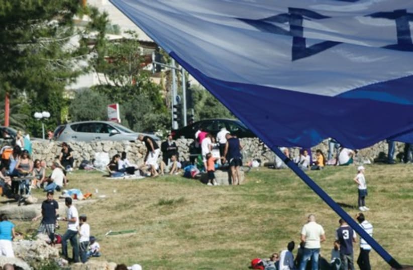 CELEBRATING INDEPENDENCE DAY at Sacher Park in Jerusalem. Our greatest triumphs have generally come on the heels of our greatest tragedies (photo credit: MARC ISRAEL SELLEM)