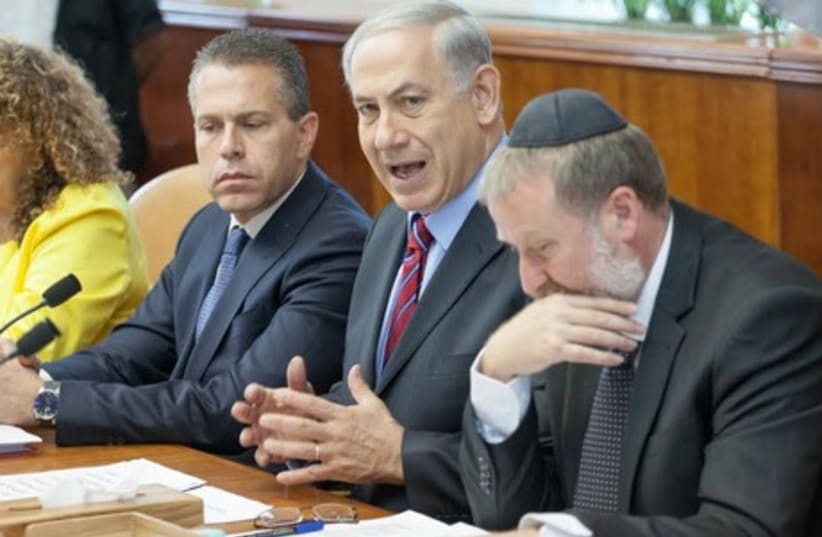 Prime Minister Binyamin Netanyahu speaks at the weekly cabinet meeting in Jerusalem. (photo credit: EMIL SALMAN/POOL)