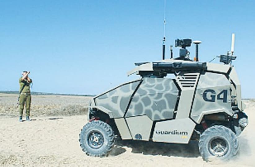 THE GUARDIUM, the UVG already in use by the Southern Command, drives along the Gaza border. (photo credit: IDF)