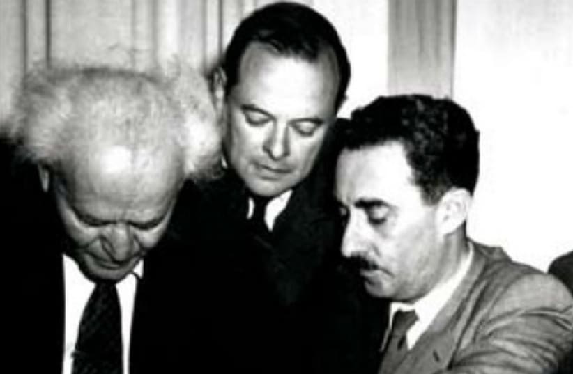 David Ben-Gurion signs the Declaration of Independence on May 14, 1948. Moshe Sharett is on the right  (photo credit: JERUSALEM POST ARCHIVE)