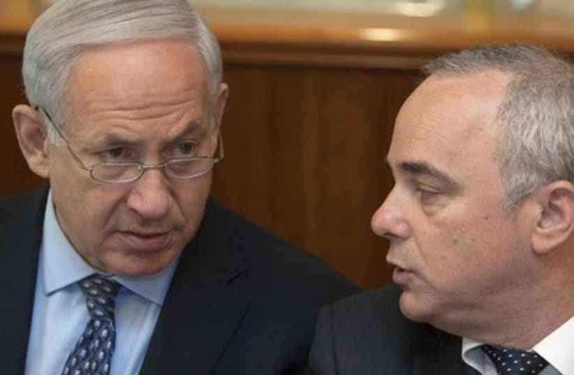 Prime Minister Binyamin Netanyahu (L) confers with Strategic Affairs Minister Yuval Steinitz in Jerusalem. (photo credit: REUTERS)