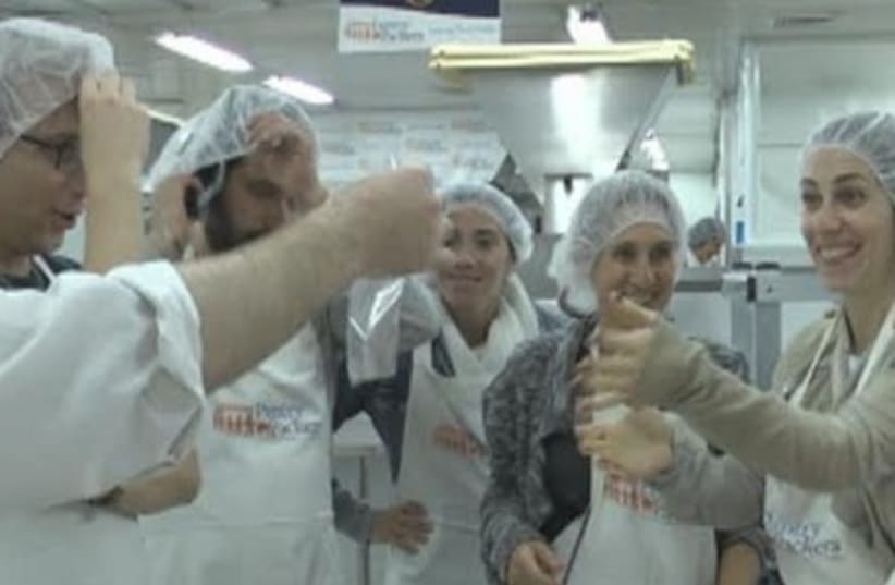 Pantry Packers volunteer packing plant of Colel Chabad in Jerusalem. (photo credit: Courtesy)