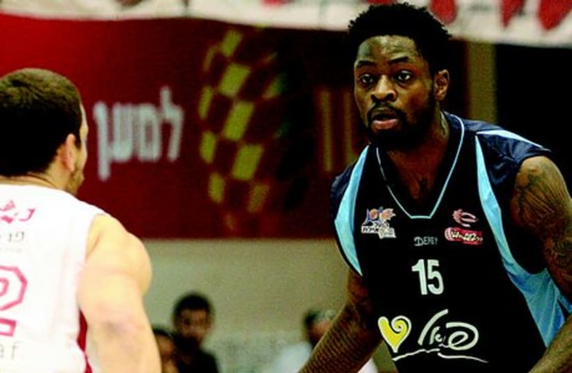 Terrico White (right) had just six points for Hapoel Eilat last night, but his team still secured its place in the BSL semifinals with an 83-73 victory over Hapoel Tel Aviv. (photo credit: ADI AVISHAI)