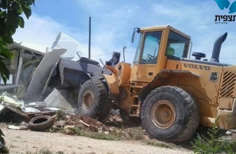 A structure deemed illegal is demolished, Givat Assaf. (photo credit: TAZPIT)