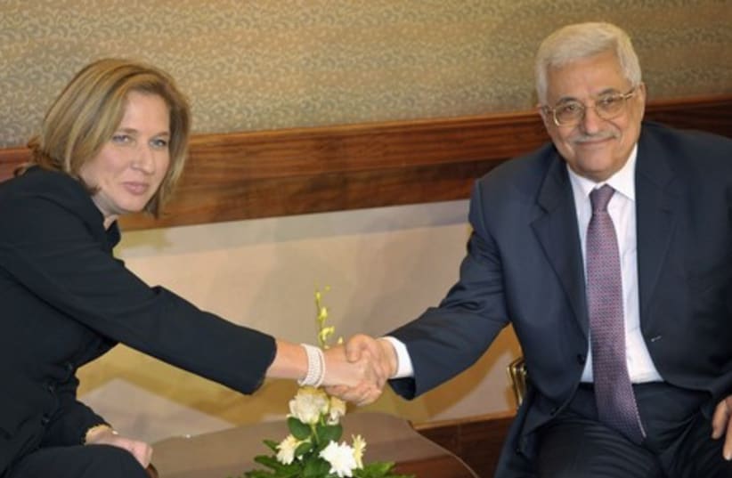 Justice Minister Tzipi Livni (L) and Palestinian Authority President Mahmoud Abbas. (photo credit: REUTERS)