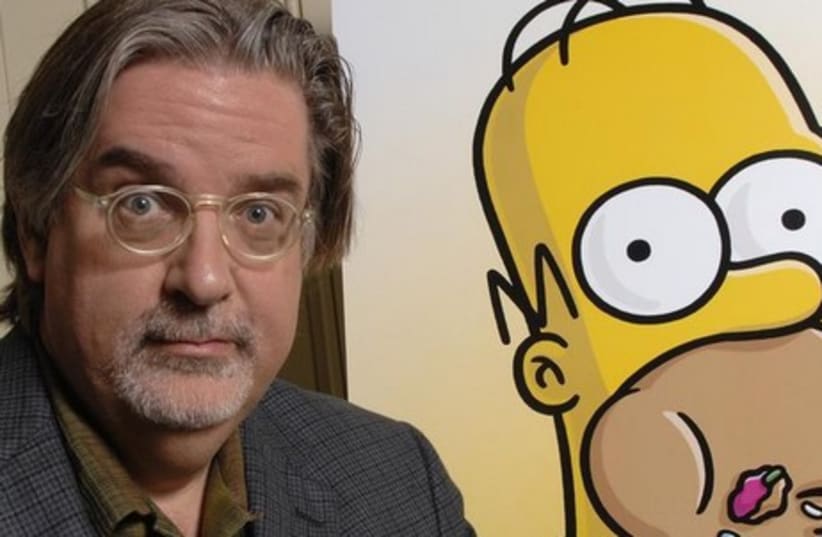 Matt Groening, creator of "The Simpsons", poses for photographs while promoting "The Simpsons Movie" in 2007. (photo credit: REUTERS)