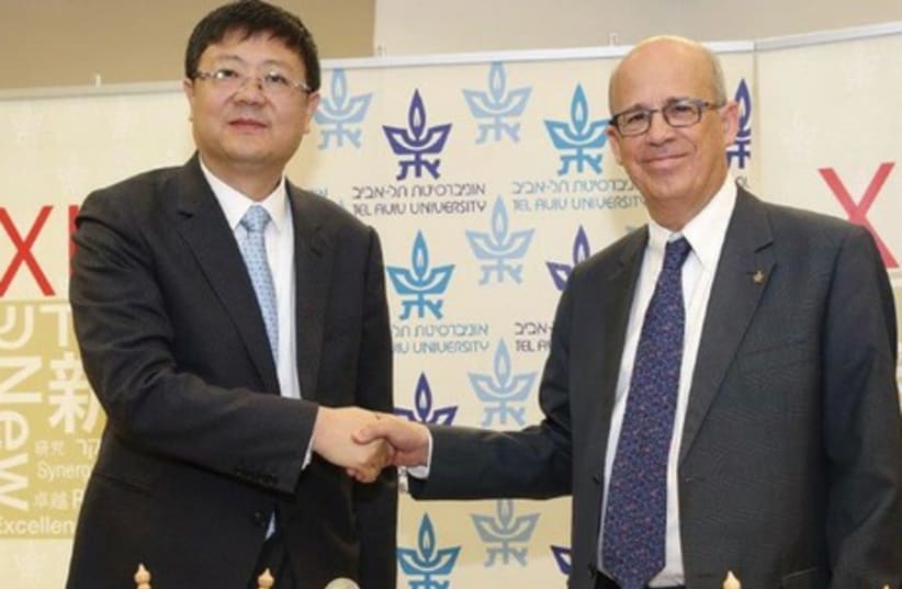 Tsinghua University president Jining Chen (left) meets with Tel Aviv University president Joseph Klafter at TAU. (photo credit: TAU)