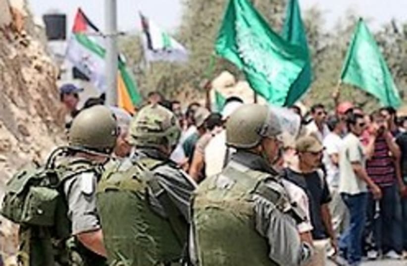 Nilin protest Border police 248.88 (photo credit: Ariel Jerozolimksi )