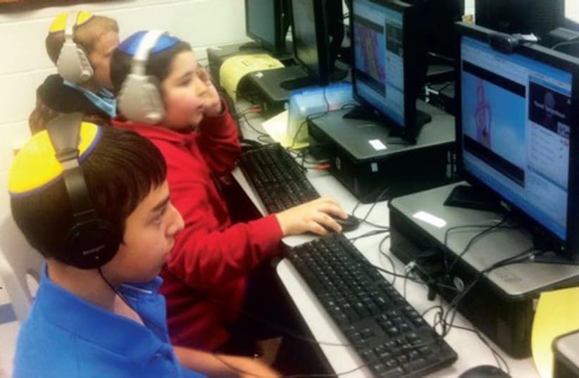 Children taking an online history course at the RPRY Day School in Edison, New Jersey (photo credit: COURTESY BONIM B’YACHAD))