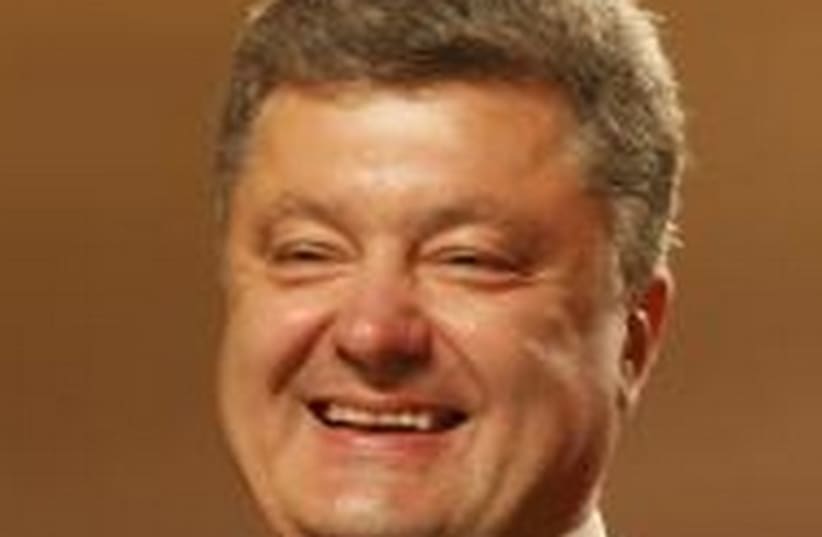Ukrainian businessman, politician and presidential candidate Petro Poroshenko smiles as he speaks to supporters at his election headquarters in Kiev May 25, 2014. (photo credit: REUTERS)