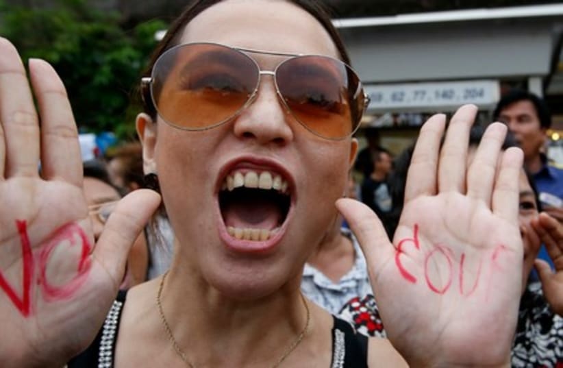 A protester chants slogans during a rally against military rule at Victory Monument in Bangkok, May 27, 2014. (photo credit: REUTERS)