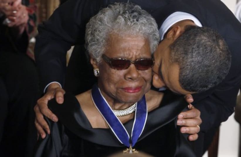 Maya Angelou receives a Medal of Freedom from US President Barack Obama at the White House in Washington, February 15, 2011. (photo credit: REUTERS)