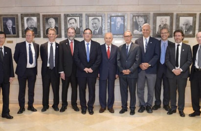 THE WOLF PRIZE: President Shimon Peres (sixth from left) and Education Minister Shai Piron (fifth from left) award the Wolf Prize to nine winners in the fields of science, medicine, agriculture, mathematics and the arts at the Knesset. (photo credit: Mark Neiman/GPO)