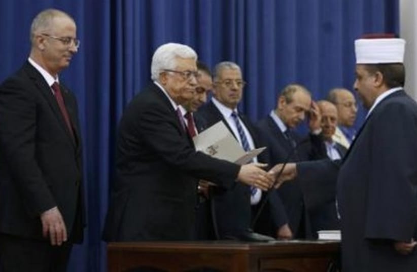 Sswearing-in ceremony of the Palestinian unity government, in Ramallah, June 2, 2014. (photo credit: REUTERS)