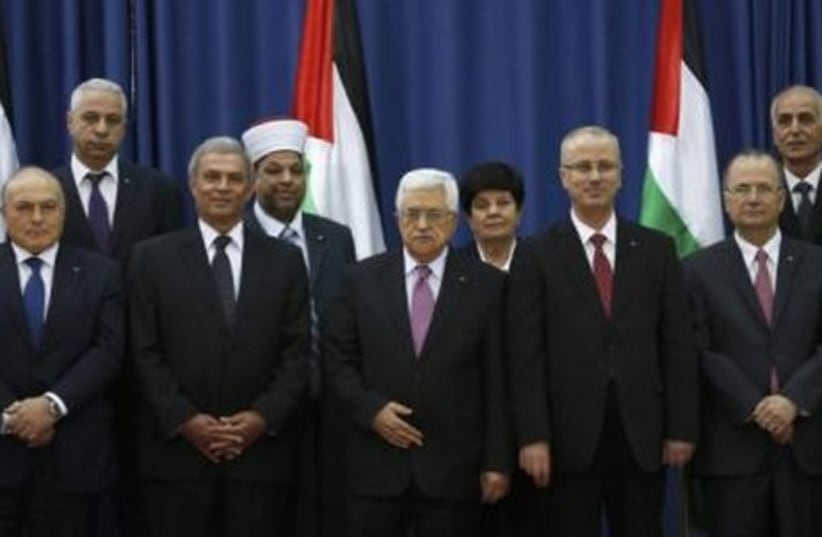 Swearing-in ceremony of the Palestinian unity government, in Ramallah, June 2, 2014. (photo credit: REUTERS)
