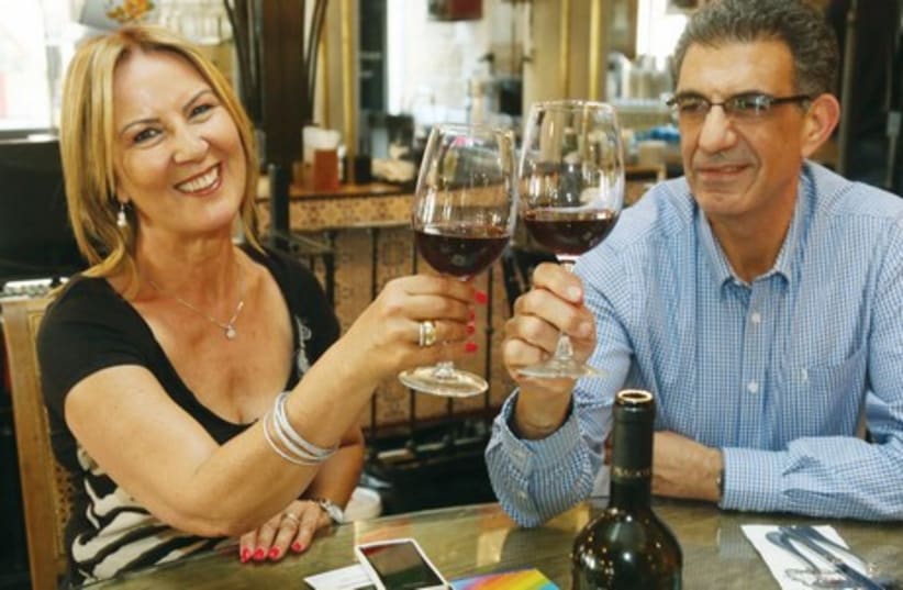SARAH SALMAN and Yossi Shar’abi discuss the upcoming Tzamid festival over a glass of Cabernet Franc. (photo credit: MARC ISRAEL SELLEM)