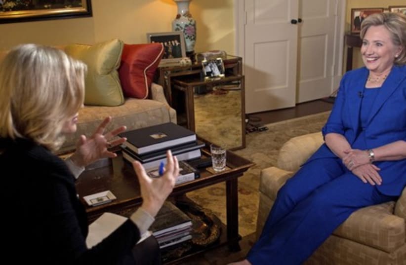 Former US secretary of state Hillary Clinton (R) talks with TV journalist Diane Sawyer. (photo credit: REUTERS)