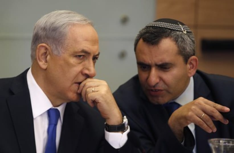 Prime Minister Binyamin Netanyahu (L) and Deputy Minister Ze'ev Elkin attend the Knesset Foreign Affairs and Defense Committee meeting on Monday. (photo credit: REUTERS)
