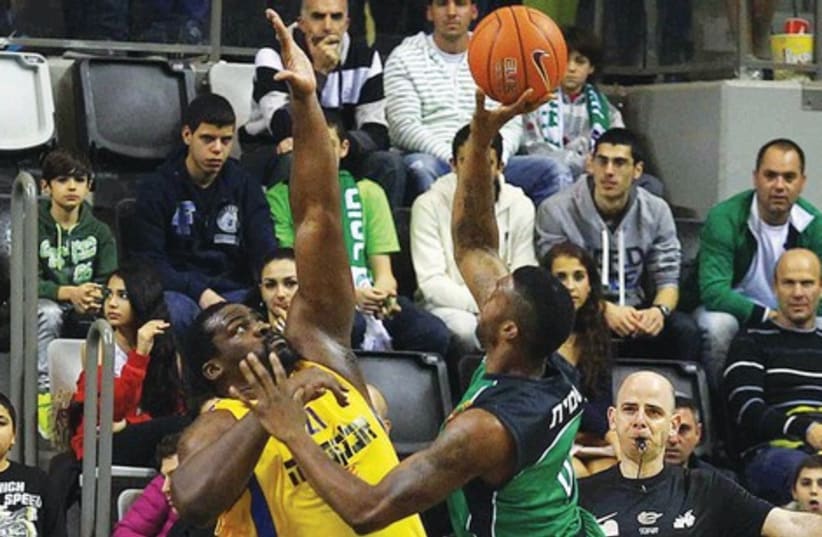 Maccabi Haifa forward Donta Smith (right) and Sofoklis Schortsanitis (left) in the first game of the two-legged BSL final. (photo credit: ALAN SHIBER/BSL)