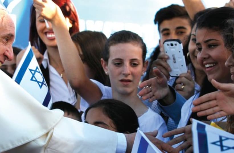Pope Francis is greeted by Israeli children after landing on Mount Scopus in Jerusalem, on May 25 (photo credit: Courtesy)