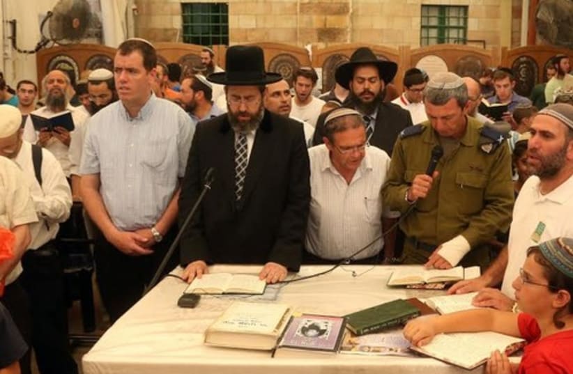 Rabbi Lau leading prayers in Hebron, June 18, 2014. (photo credit: MARC ISRAEL SELLEM)