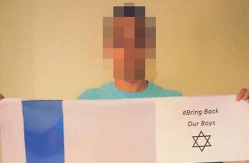 An Arab-Israeli boy received death threats for this photograph supporting the  "Bring Back Our Boys" campaign (photo credit: FACEBOOK)