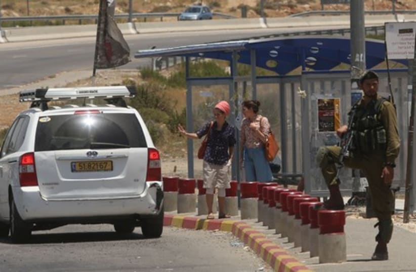 Hitchhiking in gush etsion (photo credit: MARC ISRAEL SELLEM/THE JERUSALEM POST)