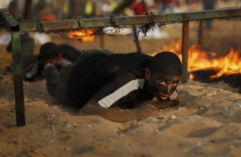 Palestinian youngsters in Gaza take part in a Hamas military training camp. (photo credit: REUTERS)