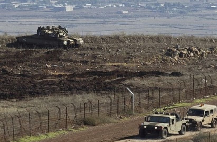 An Israeli tank is seen on the Golan Heights. (photo credit: REUTERS)