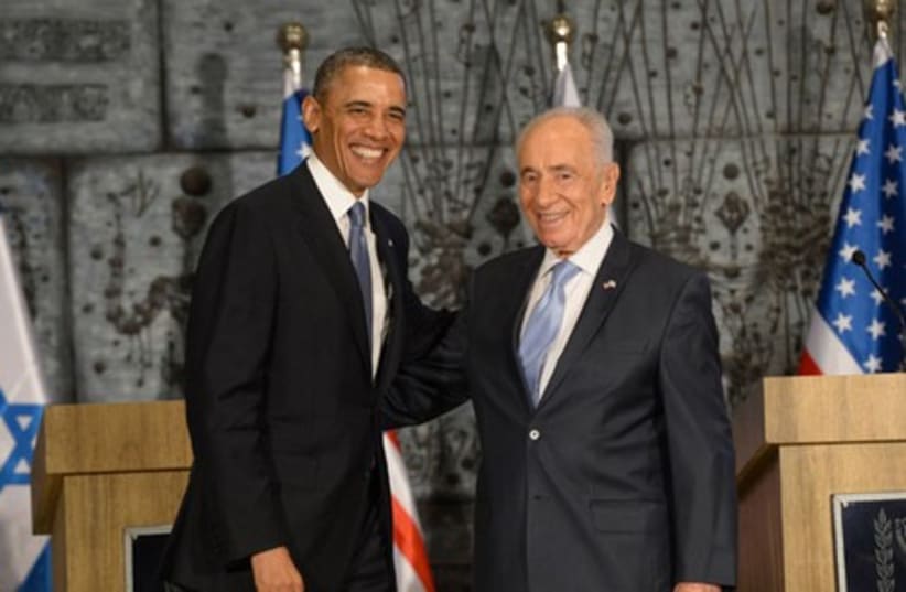 President Shimon Peres meets with US President Barack Obama, March 20, 2013.  (photo credit: AMOS BEN-GERSHOM/GPO)