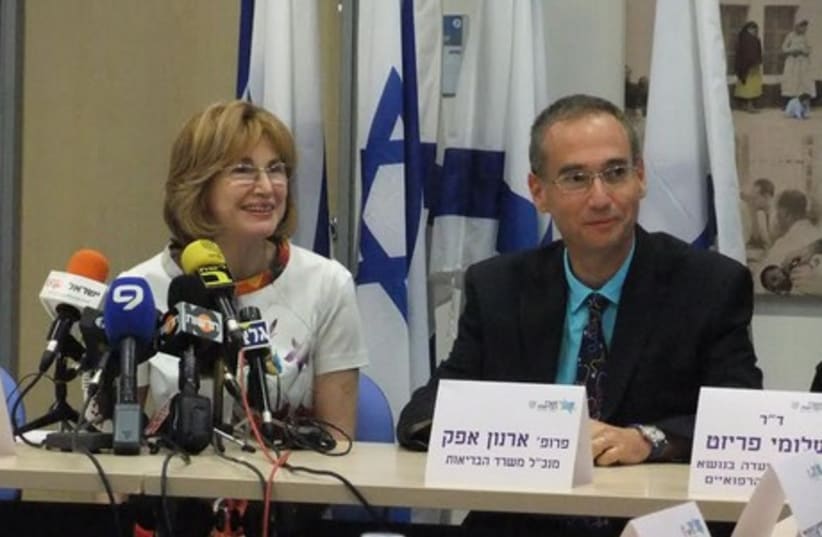 Health Minister Yael German and Prof. Arnon Afek, the ministry’s director-general, present the German Committee to Strengthen the Public Health System report in Jerusalem, June 25, 2014. (photo credit: JUDY SIEGEL-ITZKOVICH)